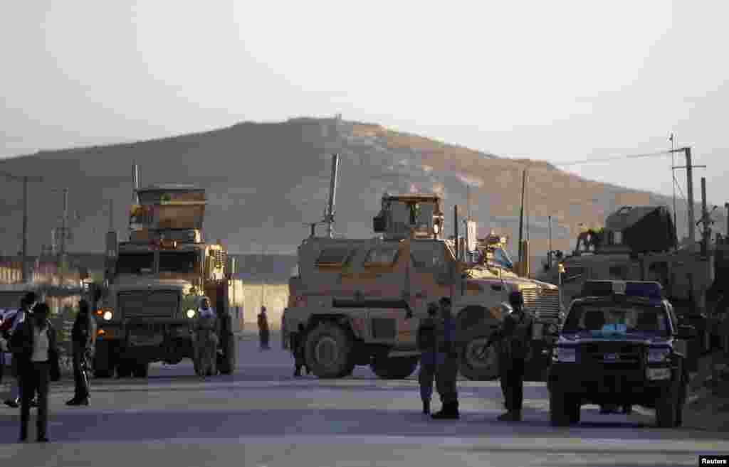 NATO forces arrive at the site of an attack in Kabul, July 2, 2013.
