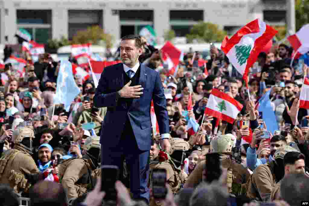 Saad Hariri, former Lebanese prime minister and the son of late premier Rafic Hariri, greets his supporters as he arrives to deliver a speech to mark 20 years since the assassination of his father, in Beirut's Martyrs' Square.