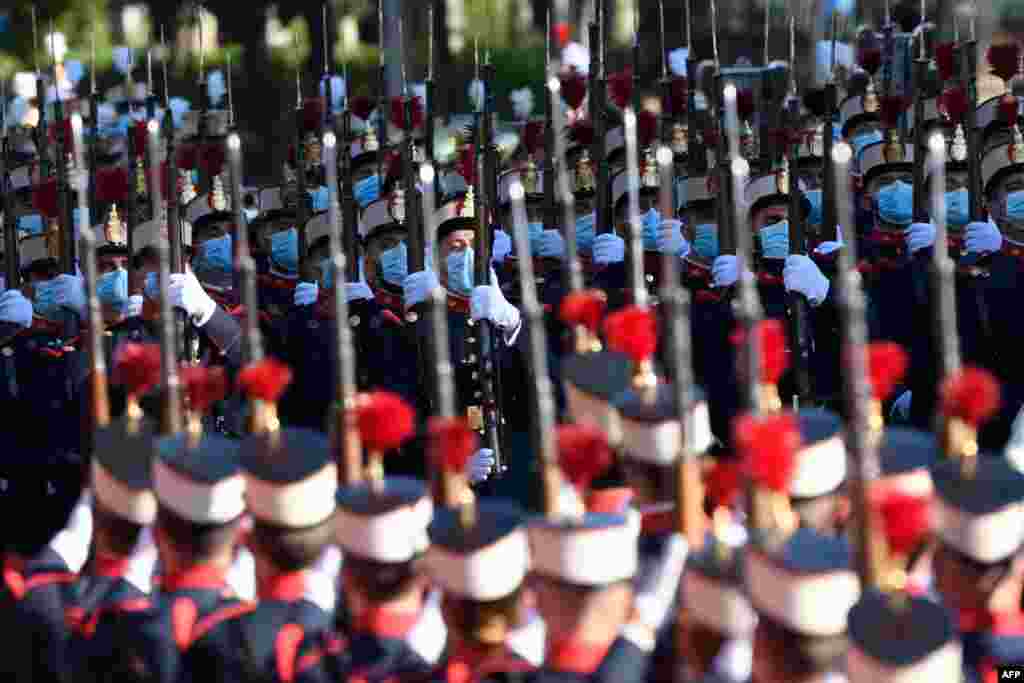 Spanish troops march during the Spanish National Day military parade in Madrid.