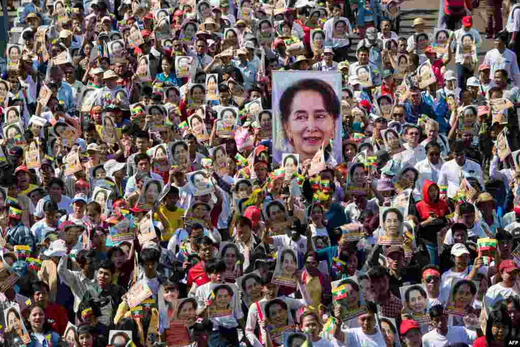 People participate in a rally in Yangon, in support of Myanmar's State Counsellor Aung San Suu Kyi, as she prepares to defend Myanmar at the International Court of Justice in The Hague against accusations of genocide against Rohingya Muslims.