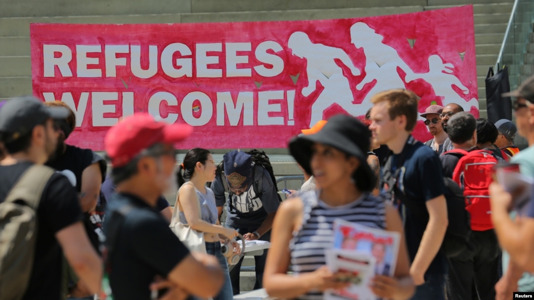  People gather for an anti-racism rally in downtown Toronto, Aug. 11, 2018. Canada announced Wednesday plans to increase deportations of immigrants in the country illegally.