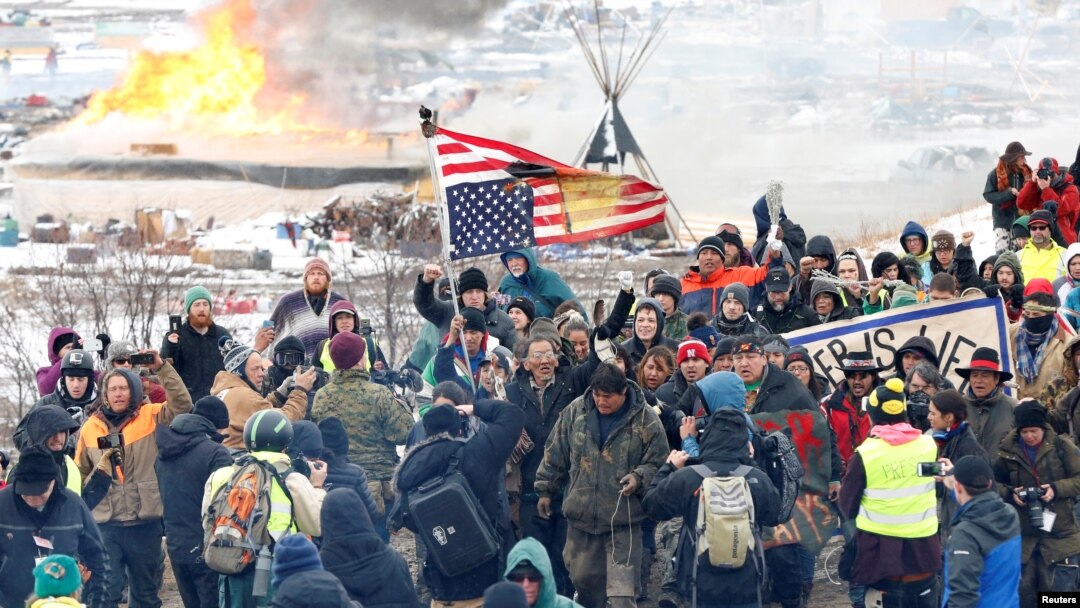 Opponents of the Dakota Access oil pipeline march out of their main camp near Cannon Ball, North Dakota, U.S., February 22, 2017.