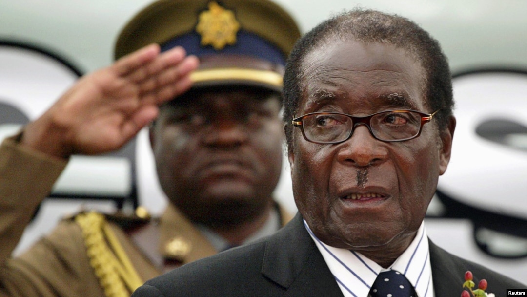 FILE - Zimbabwe President Robert Mugabe attends the launch of basic commodities in Harare, Zimbabwe.