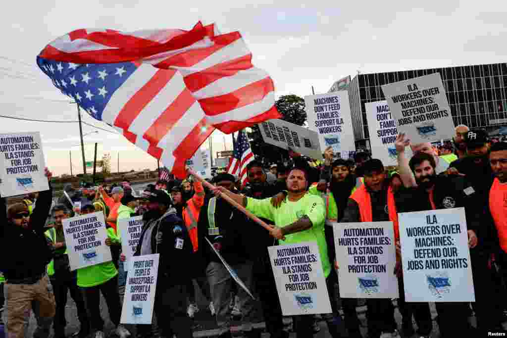 Members of the International Longshoremen's Association union, which represents roughly 45,000 workers, go on strike outside Maher Terminal in Elizabeth, New Jersey. U.S. East Coast and Gulf Coast dockworkers began a strike, their first large-scale stoppage in nearly 50 years, halting the flow of about half the nation's ocean shipping after negotiations for a new labor contract broke down over wages.