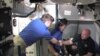 Astronauts Experience Drops of Jupiter, High Flying Hand-off