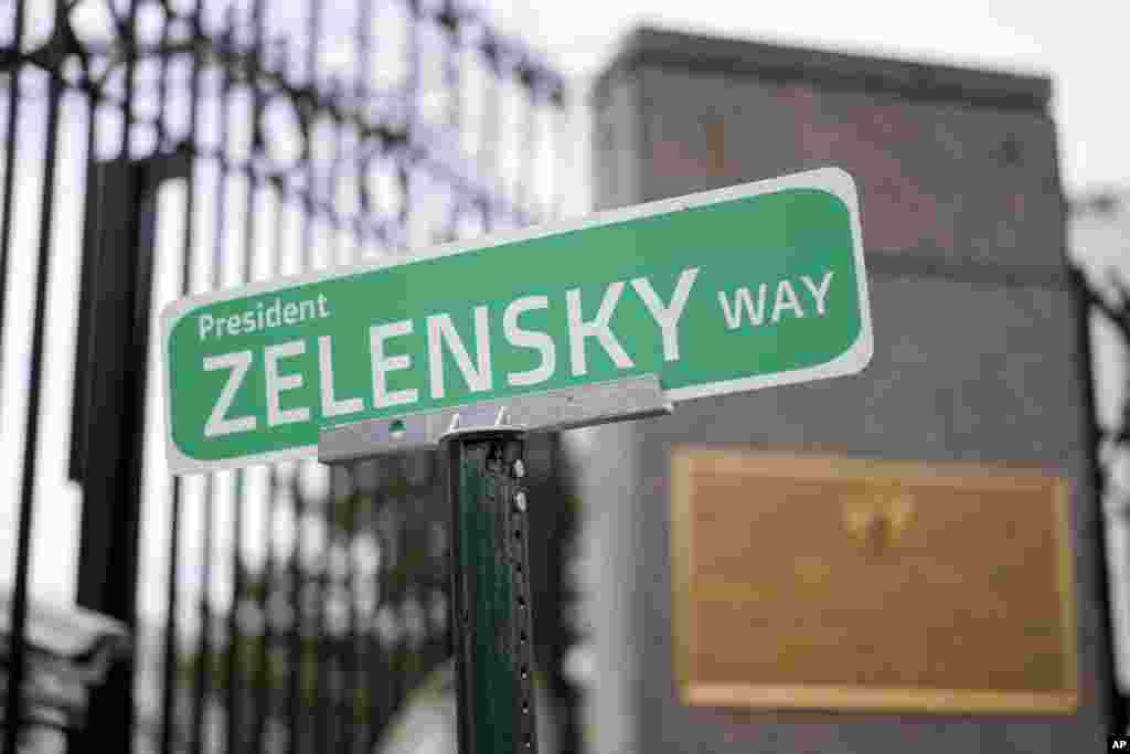 A sign that reads "President ZELENSKY WAY" is seen in front of the Embassy of Russian Federation in Washington.
