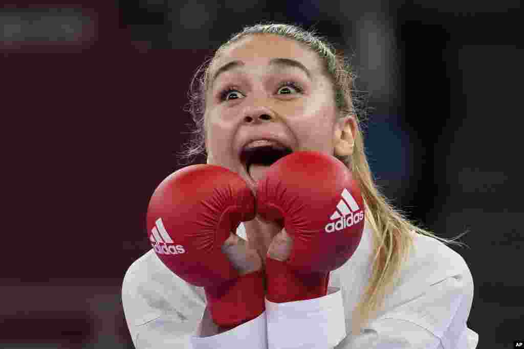 Anzhelika Terliuga of Ukraine reacts after winning against Wen Tzu-yun of Taiwan in the women's kumite -55kg semifinal bout for Karate at the 2020 Summer Olympics in Tokyo, Japan.