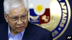 Philippine Foreign Affairs Secretary Albert Del Rosario addresses the media during a press conference in suburban Pasay City, south of Manila, Philippines, after his return from the ASEAN Regional Forum in Cambodia Friday, July 13, 2012. Del Rosario deplo