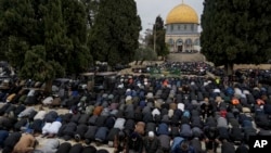Muslim worshippers perform Friday prayers at the Al-Aqsa Mosque compound in the Old City of Jerusalem during the holy month of Ramadan, March 7, 2025.