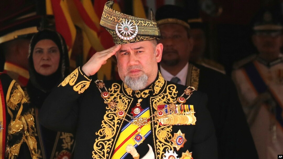 Malaysia King Sultan Muhammad V salutes during the national anthem at the opening of the 14th parliament session at the Parliament house in Kuala Lumpur, July 17, 2018. 