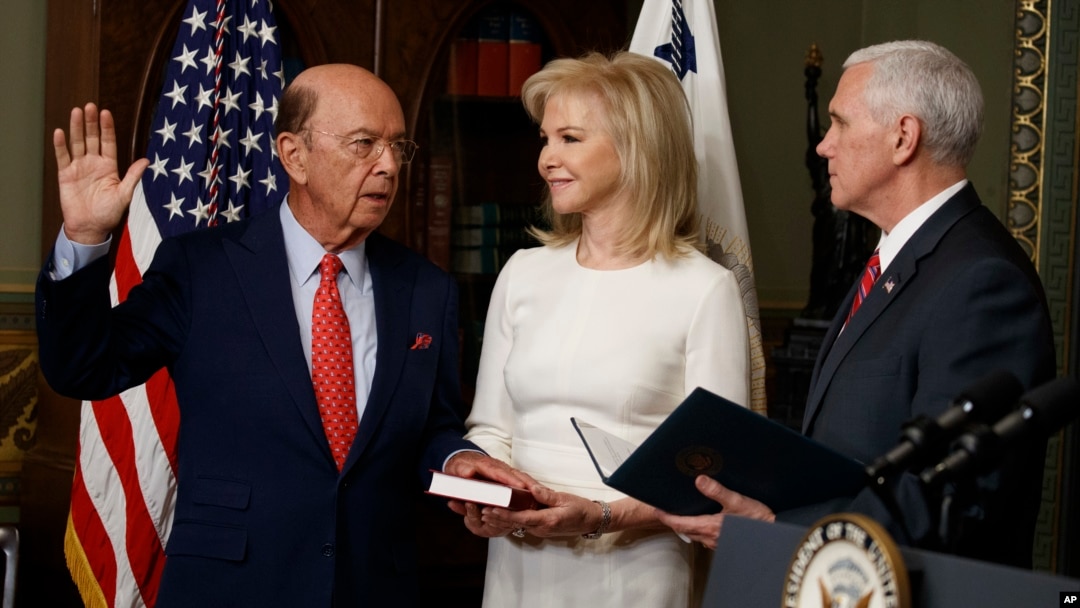 Hilary Ross, center, watches as Vice President Mike Pence swears-in new Commerce Secretary Wilbur Ross, Feb. 28, 2017, in the Vice President's ceremonial office in the Eisenhower Executive Office Building on the White House complex in Washington.