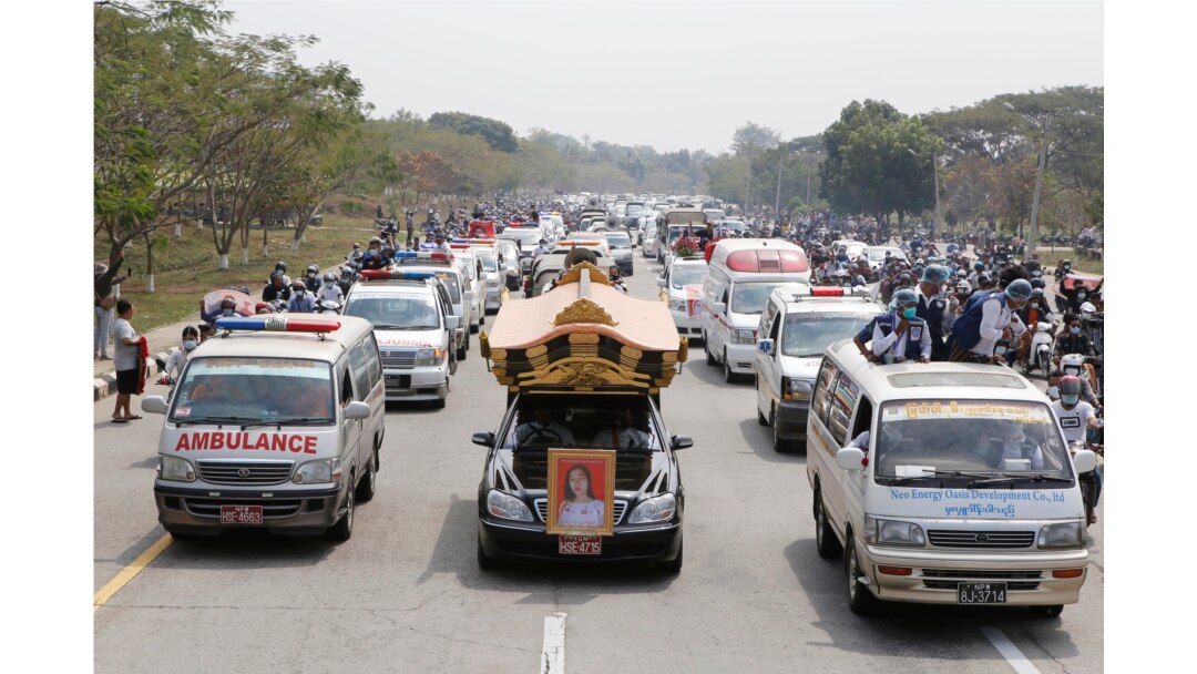 A hearse containing casket of Mya Thwet Thwet Khine travels to the cemetery in Naypyitaw, Myanmar, Sunday, Feb. 21, 2021.