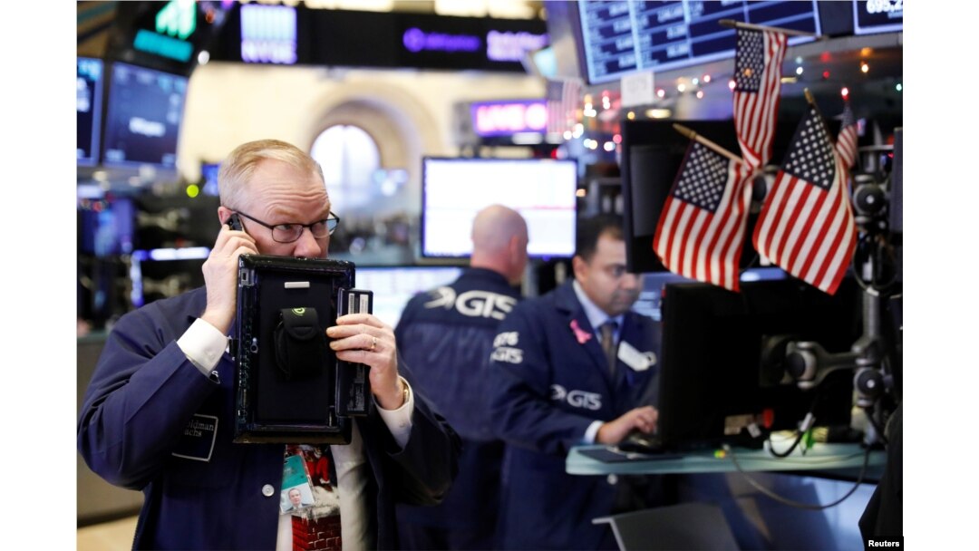 Traders work on the floor of the New York Stock Exchange shortly after the opening bell in New York, Dec. 24, 2018.