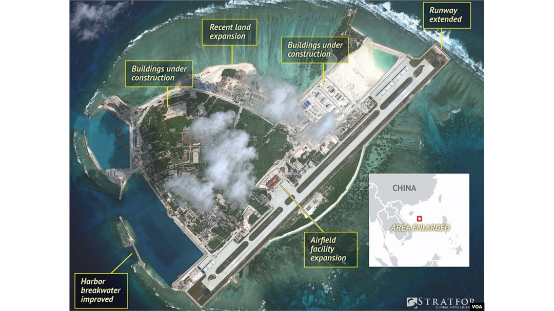 Satellite imagery analysis by geopolitical intelligence firm Stratfor shows overall land, building and military expansion by China on Woody Island in the South China Sea. (Courtesy of Stratfor)