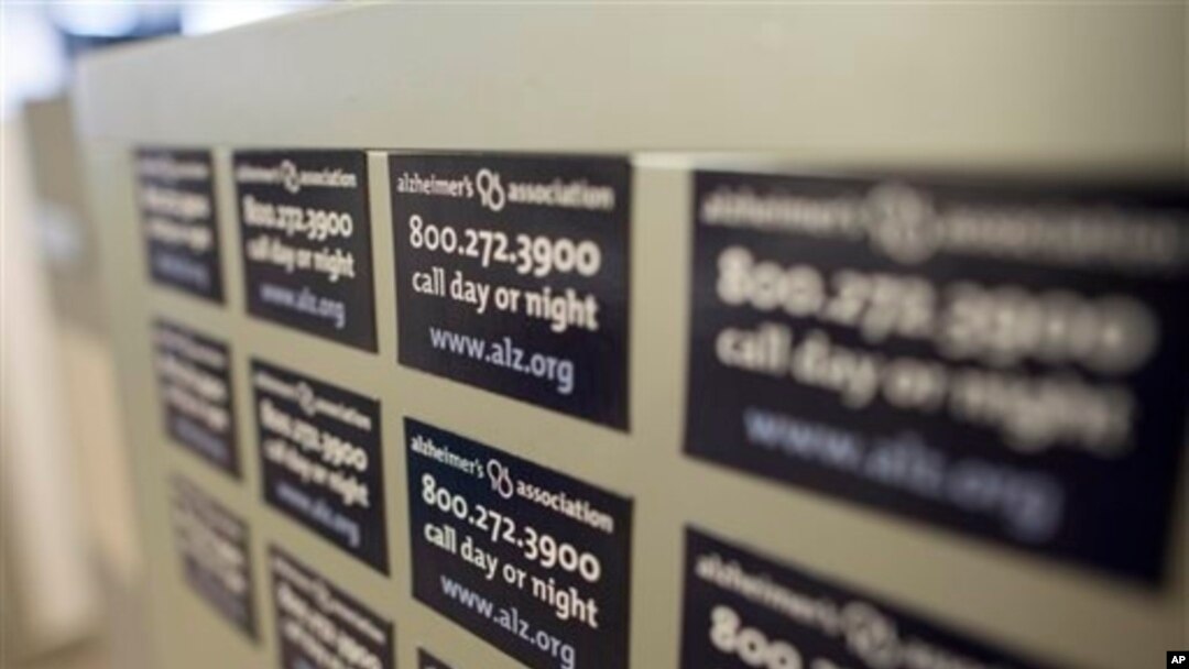 Cabinet magnets at the Alzheimer's Association Headquarters advertise the group's help line, Chicago, Illinois, June 21, 2013.