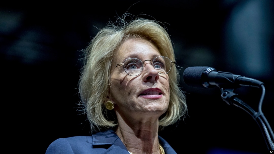 President-elect Donald Trump's pick for Education Secretary Betsy DeVos speaks during a rally at DeltaPlex Arena, Friday, Dec. 9, 2016, in Grand Rapids, Mich.