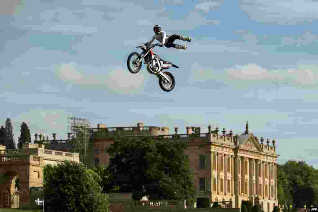 Dan Whitby of the Bolddog Lings FMX Display Team performs in the Grand Ring on the first day of the Chatsworth Country Fair in the grounds of Chatsworth House, near Bakewell in northern England.