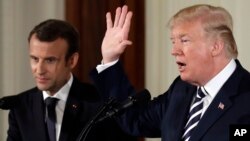 President Donald Trump speaks during a news conference with French President Emmanuel Macron in the East Room of the White House, April 24, 2018, in Washington.