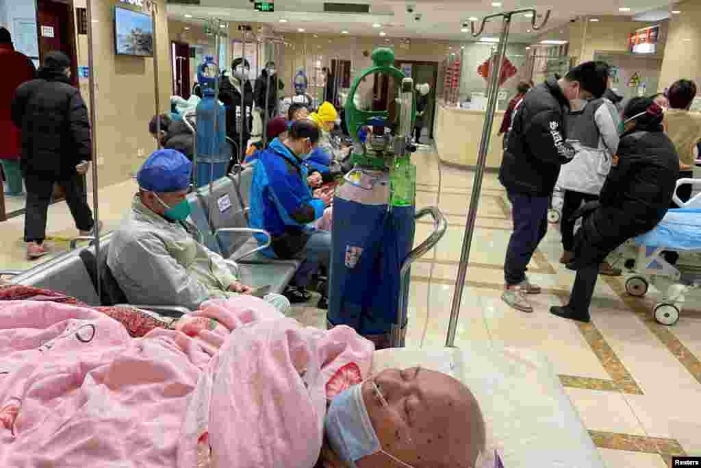 A patient lies on a bed at the emergency department of a hospital, amid COVID-19 outbreak in Shanghai, China.