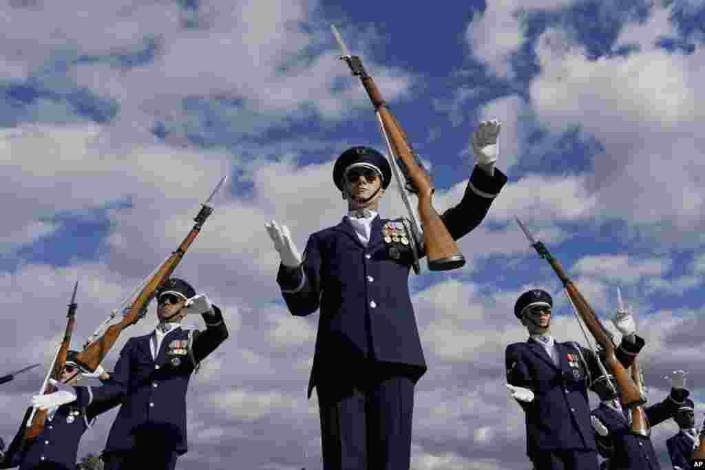 Members of the U.S. Air Force Honor Guard Drill Team, lead Master Sgt. Antonio Lofton, perform during the Joint Service Drill-Off at the Lincoln Memorial in Washington, Oct. 19, 2022.