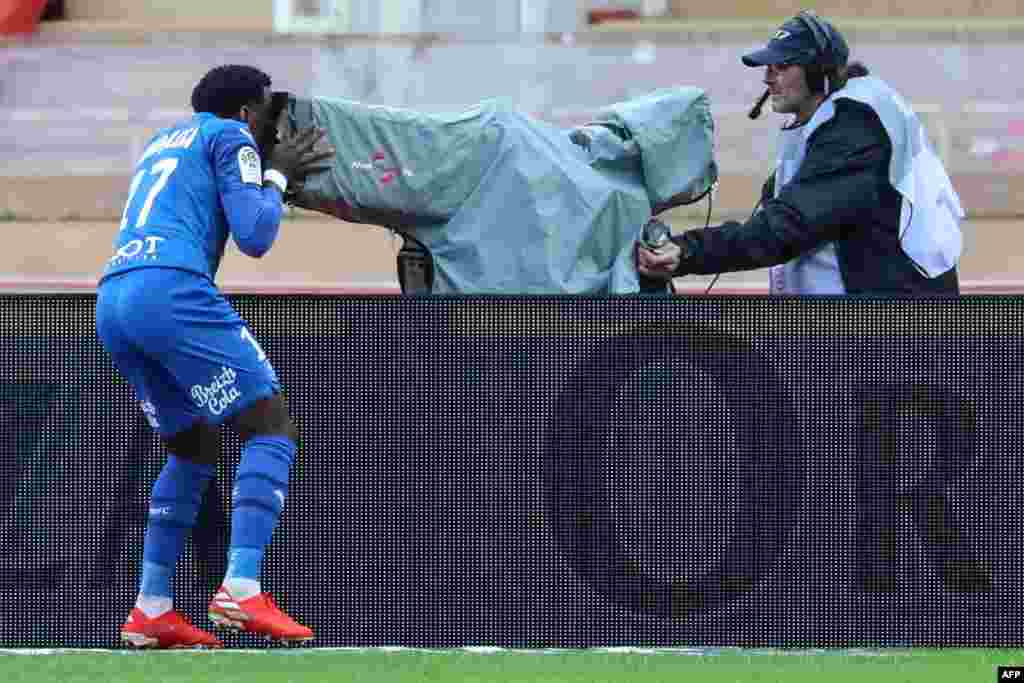 Rennes' French defender Faitout Maouassa (L) celebrates after scoring a goal during the French L1 football match Monaco vs Rennes at the "Louis II Stadium" in Monaco.
