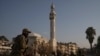 New Syrian authorities arrest official from notorious prison, war monitor says