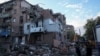 FILE - Rescuers work at the site of a residential building hit by a Russian missile strike, amid Russia's attack on Ukraine, in Kharkiv, May 31, 2024.