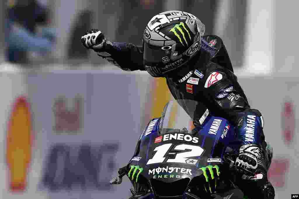 Monster Energy Yamaha's Spanish rider Maverick Vinales celebrates his victory in the MotoGP-class Malaysian Grand Prix motorcycle race at the Sepang International Circuit in Sepang, Malaysia.