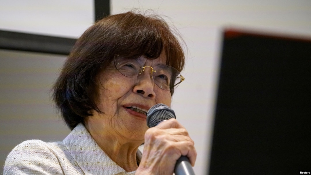 Atomic bomb survivor Teruko Yahata speaks to foreign visitors in Hiroshima