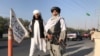 A Taliban fighter holding an M16 assault rifle stands outside the Interior Ministry in Kabul on August 16, 2021. (Reuters)
