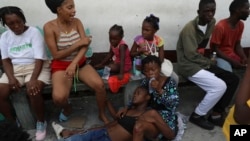 An asthmatic girl rests as she takes refuge in a private school serving as a shelter for residents fleeing gang violence in the Nazon neighborhood, in Port-au-Prince, Haiti, Nov. 14, 2024.