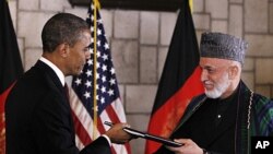 Troca protocolar do acordo estratégico assinado entre o presidente Obama e o seu homólogo afegão, Hamid Karzai