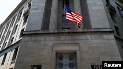 FILE - The U.S. Department of Justice headquarters building in Washington.