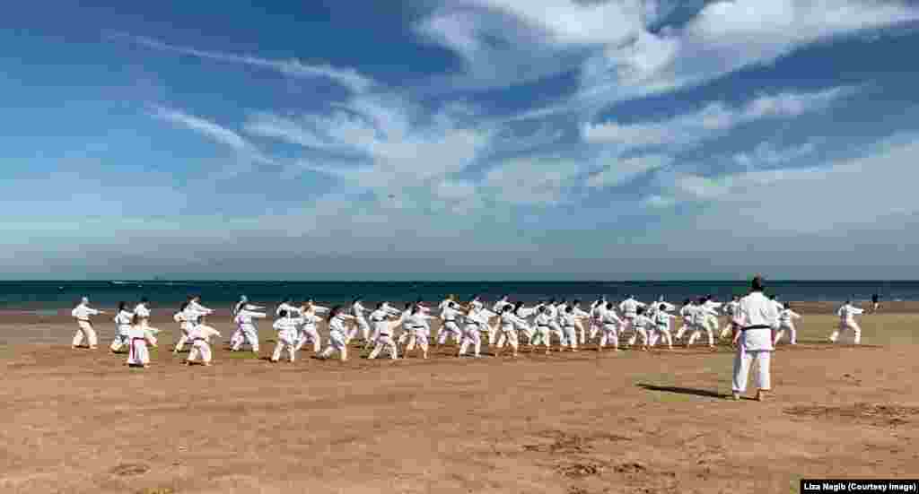 Members of the Seki Ryuzan Karate club demonstrate their skills during the 30th anniversary of the club on the Benllech beach in Benllech, United Kingdom.