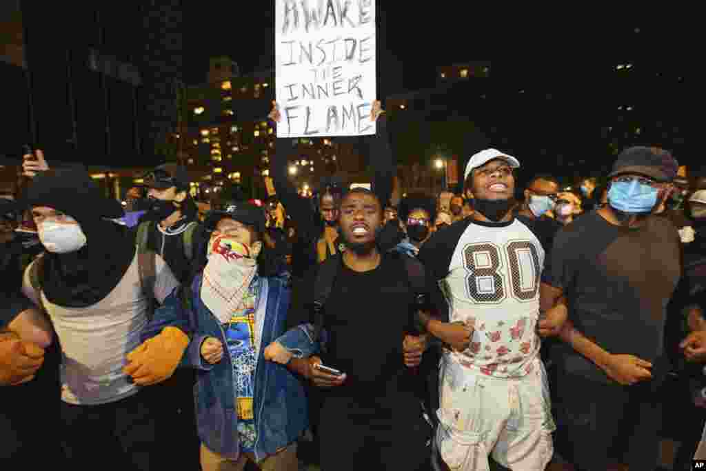Activists march to the Brooklyn Bridge on May 31, 2020, in New York.