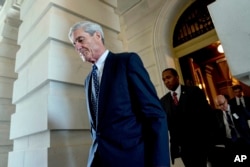 FILE - Former FBI Director Robert Mueller, the special counsel probing Russian interference in the 2016 election, departs Capitol Hill following a closed door meeting in Washington, June 21, 2017.