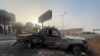 A burned vehicle is seen in Khartoum, on April 26, 2023. (El-Tayeb Siddig/Reuters)