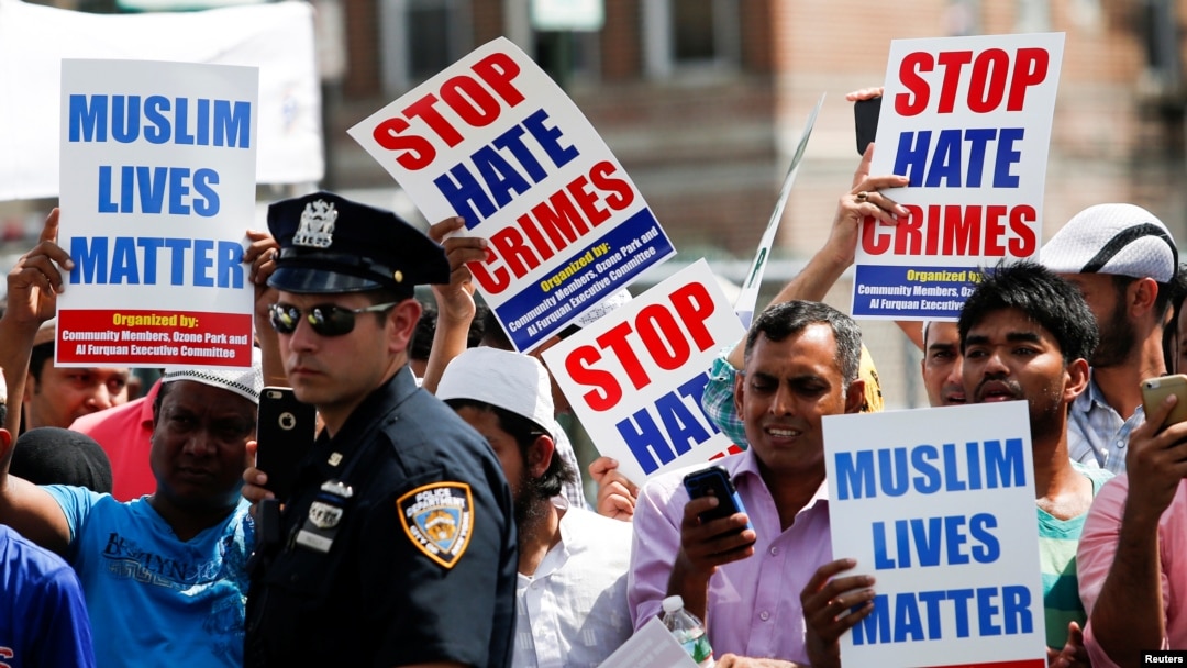 Community members take part in a protest to demand stop hate crime during the funeral service of Imam Maulama Akonjee, and Thara Uddin in the Queens borough of New York City, Aug. 15, 2016. 