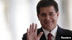 FILE - Paraguay's President Horacio Cartes gestures while in Brasilia, July 17, 2015. 