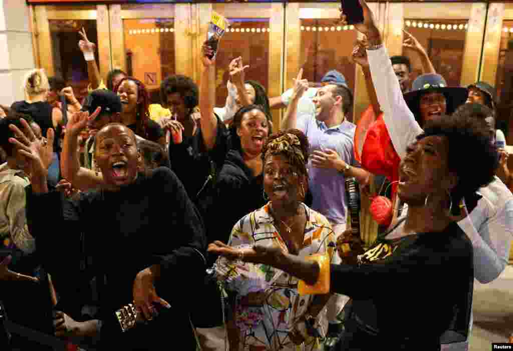 People dance at a block party after attending the opening night of previews for "Pass Over," following the 17-month shutdown of Broadway due to the COVID-19, at the August Wilson Theatre in New York City, Aug. 4, 2021.
