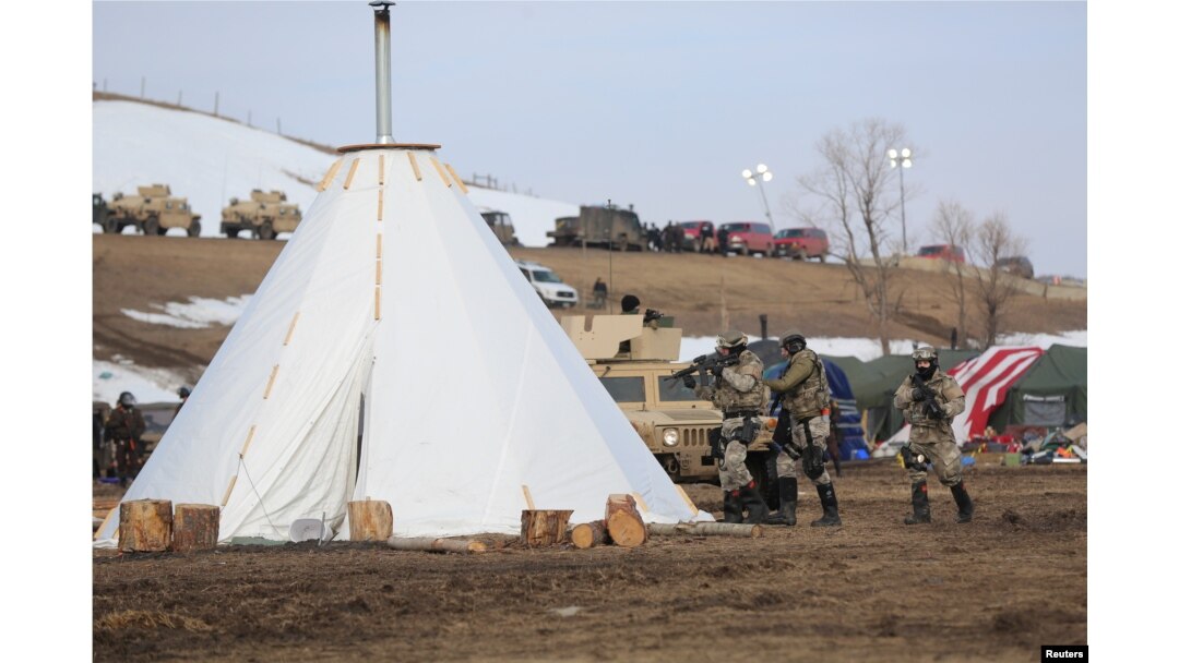 Police attempt to clear the Oceti Sakowin camp in Cannon Ball, North Dakota, U.S., February 23, 2017.