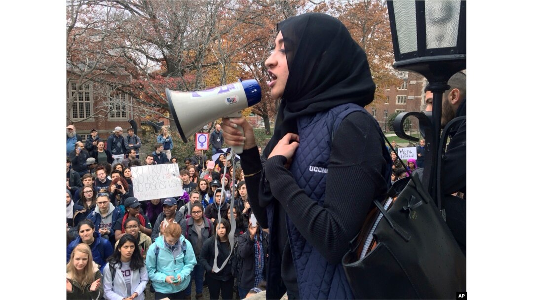 Muslim student Eeman Abbasi speaks during a protest on the University of Connecticut campus in Storrs against the election of Republican Donald Trump as president, Nov. 9, 2016.