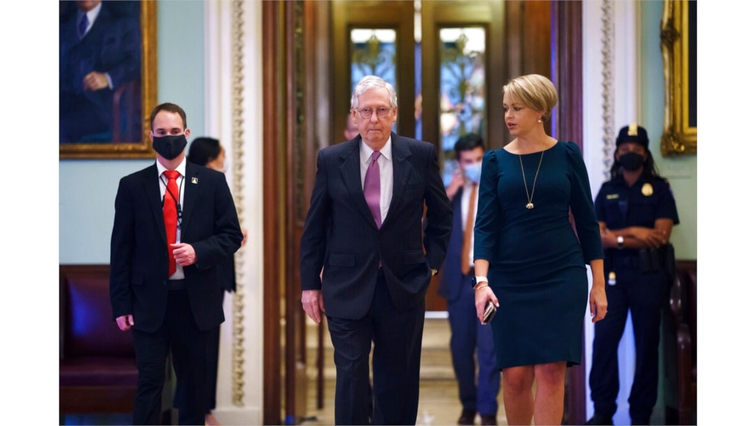 Senate Minority Leader Mitch McConnell, R-Ky., returns to his office from the Senate chamber before votes, at the Capitol in Washington, Sept. 30, 2021.