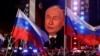 Vladimir Putin attends a rally marking the 10th anniversary of Russia's annexation of Crimea from Ukraine in Moscow on March 18, 2024.