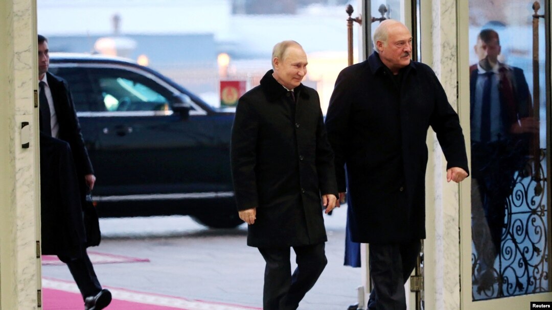 Russian President Vladimir Putin and Belarusian President Alexander Lukashenko arrive for meeting in Minsk