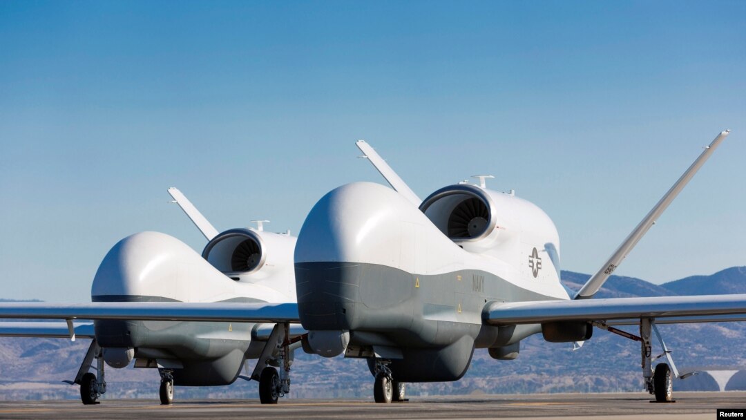 FILE - Two Northrop Grumman MQ-4C Triton unmanned aerial vehicles are seen on the tarmac at a Northrop Grumman test facility in Palmdale, Calif., May 22, 2013, in this handout photo provided by the U.S. Navy May 22, 2013.