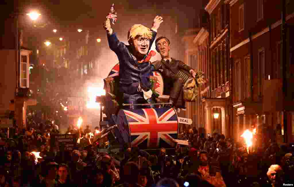 Effigies of Britain's Prime Minister Boris Johnson and Leader of the House of Commons Jacob Rees-Mogg are paraded through the town during the annual Bonfire Night festivities in Lewes, Britain, Nov. 5, 2019.