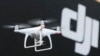 FILE - A Phantom 4, developed by major Chinese consumer-drone maker DJI, flies during its demonstration flight in Tokyo, March 3, 2016. 