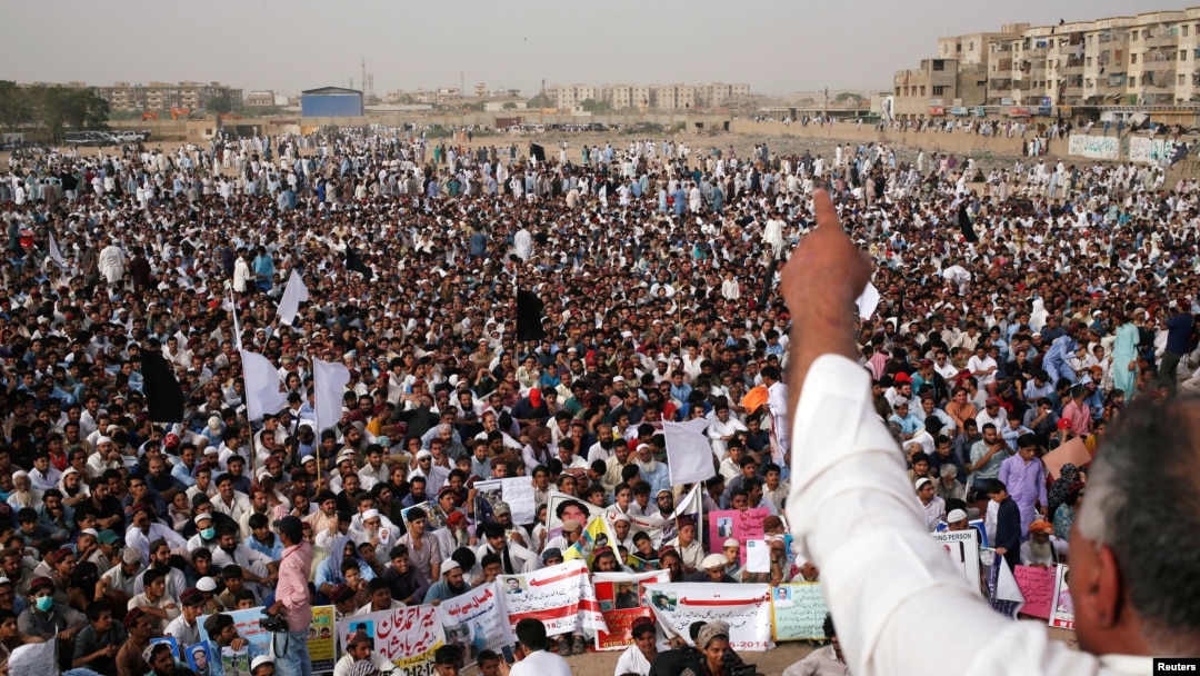Members of Pakistan's Pashtun community, listen to their leader during a rally against, what they say, are human rights violations, organized by the Pashtun Tahaffuz Movement (PTM) in the southern city Karachi, Pakistan, May 13, 2018.