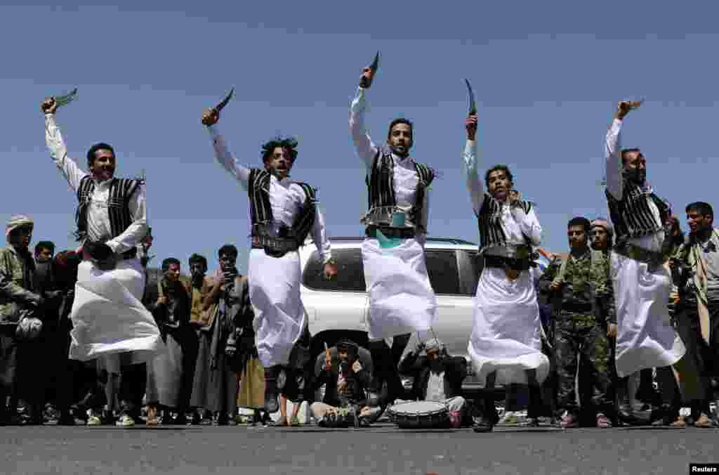 Houthi supporters perform the traditional Baraa dance during a ceremony held to collect supplies for Houthi fighters in Sana'a, Yemen.